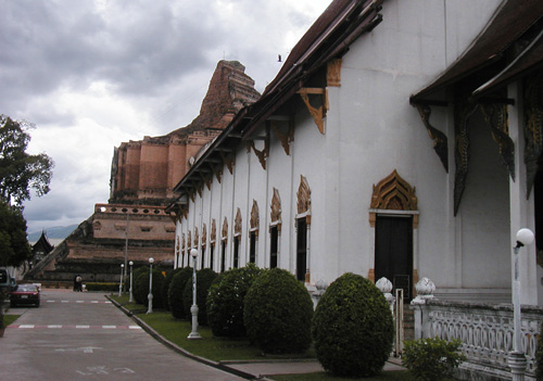 Note mountain of stupa in back of building.