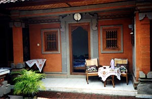 Sitting and dining area is typically on porch of homestay.