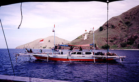 Families live on these fishing boats that are stablized with outriggers.