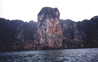 Limstone formations undercut at the waterline.